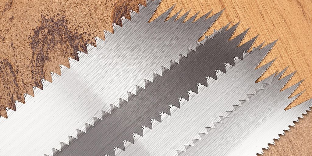 Different saw blades for table saw on a wooden background.